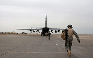 Soldier Preparing to Board Plane